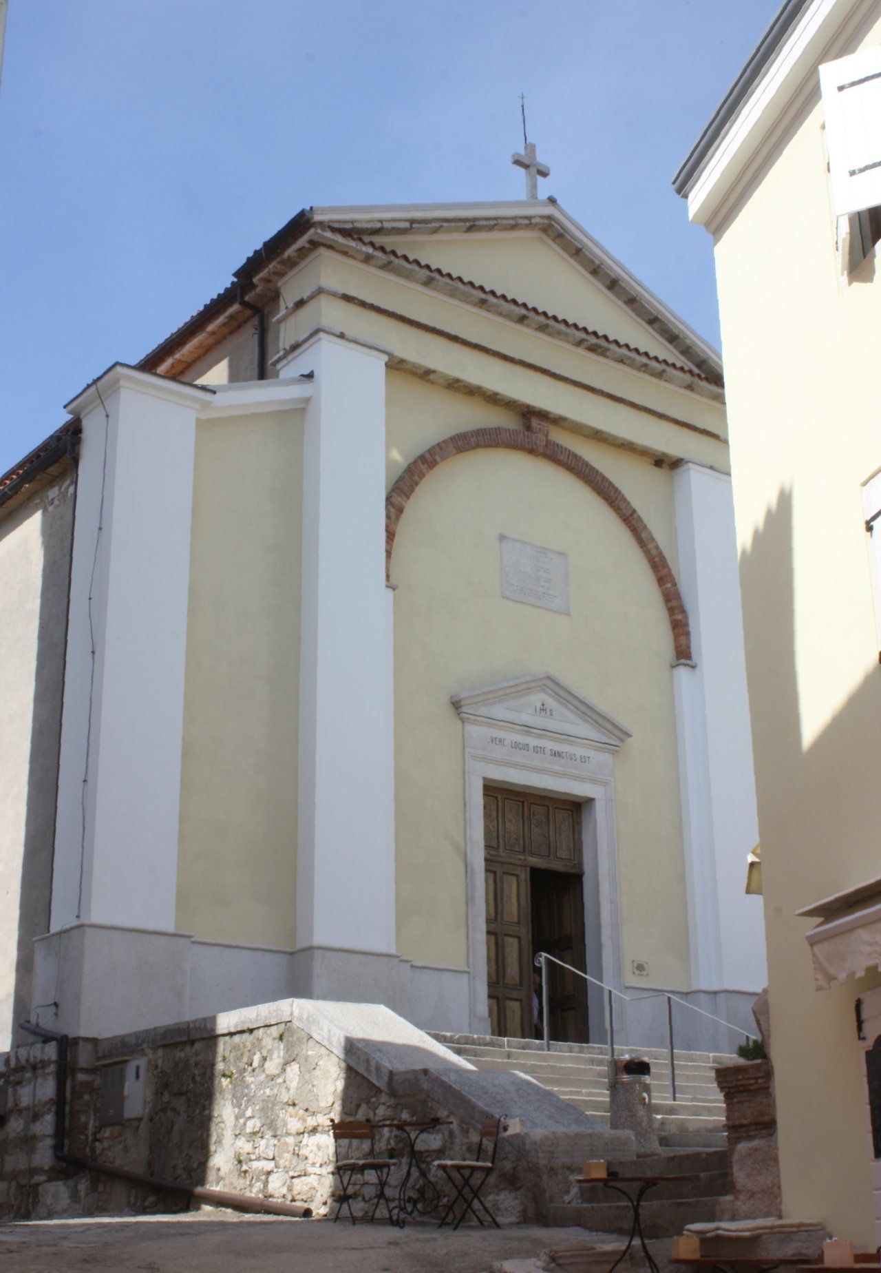The facade and entrance steps of St Martin’s Church in Vrsar